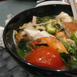 A bowl of Canh Chua from a restaurant